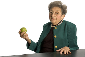 Image showing senior woman with apple