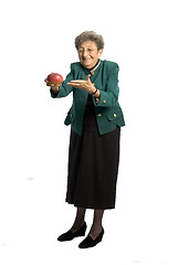 Image showing senior woman with mango