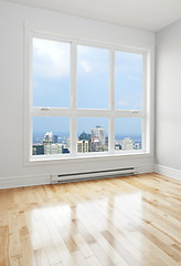 Image showing Downtown seen through the window of a room