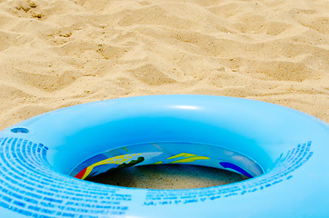 Image showing blue circle on sand