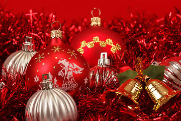 Image showing Red christmas balls and decorations on red