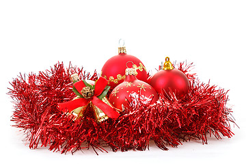 Image showing Red christmas balls and decorations on white