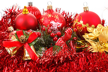 Image showing Red christmas balls and decorations on white