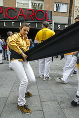 Image showing Castellers, placing the belt