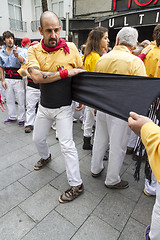 Image showing Castellers, placing the belt