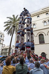 Image showing Castellers, girls and drop-tower