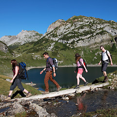 Image showing Young people hiking in the mountains