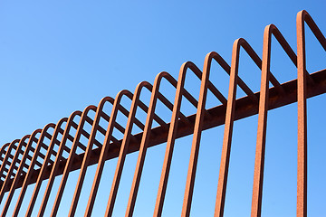 Image showing Metal fence with bent rods