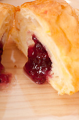 Image showing croissant French brioche filled with berries jam