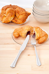 Image showing croissant French brioche filled with berries jam