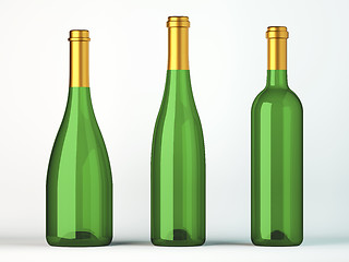 Image showing Three green bottles for wine with golden labels 