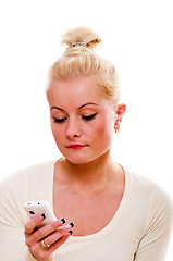 Image showing The young woman talks by a mobile phone