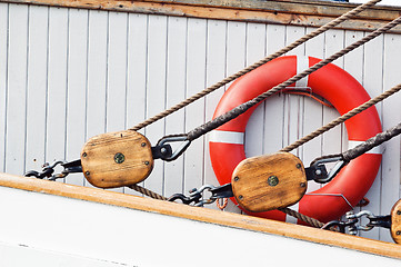 Image showing Ancient wooden sailboat pulleys and ropes detail 