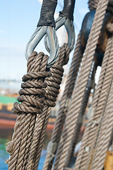 Image showing Ancient wooden sailboat pulleys and ropes detail 