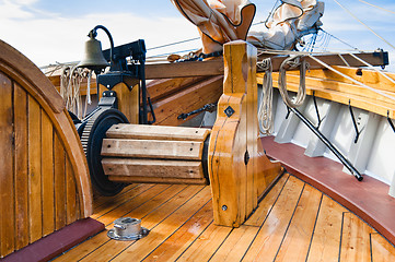 Image showing ship's Bell and anchor lifting mechanism on an old sailboat 