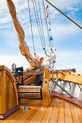 Image showing ship's Bell and anchor lifting mechanism on an old sailboat 