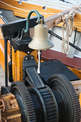 Image showing ship's Bell and anchor lifting mechanism on an old sailboat 