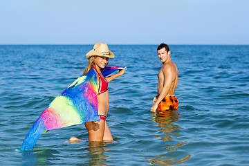 Image showing Smiling teen girl and young man