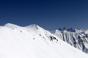 Image showing Snowy slope in high mountains