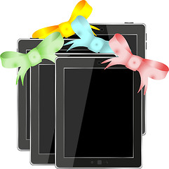 Image showing Tablet pc set with ribbons and bow isolated on a white