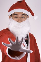 Image showing Asian Santa Claus Saying No