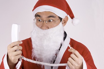 Image showing Asian Santa Claus With Telephone