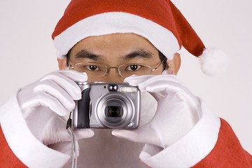 Image showing Asian Santa Claus with Camera