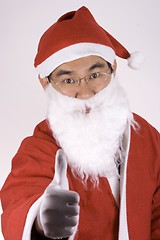 Image showing Asian Santa Claus With Thumbs Up
