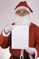 Image showing Asian Santa Claus with blank paper