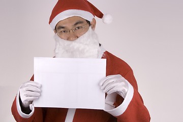 Image showing Asian Santa Claus with blank paper