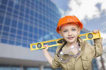 Image showing Child Boy Dressed Up as Handyman in Front of Building