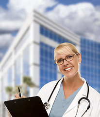 Image showing Friendly Female Blonde Doctor or Nurse in Front of Building