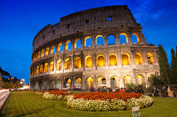 Image showing Beautiful view of Colosseum at sunset with flowerbed in foregrou