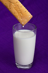 Image showing a glass of milk with a cookie