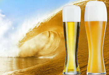 Image showing Two glasses of gold beer over the big beer wave