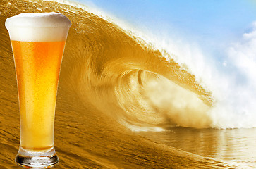 Image showing Gold beer glass over a big beer wave.