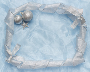 Image showing christmas ball on blue silk frame