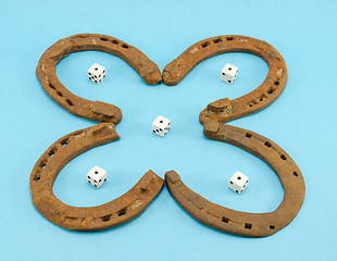 Image showing clover retro horse shoes gamble dice on blue 