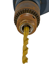 Image showing Rusty old electric drill golden bit closeup 