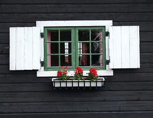 Image showing Decorative window of wooden cabin