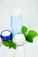 Image showing face cream and lotion with urtica leaves