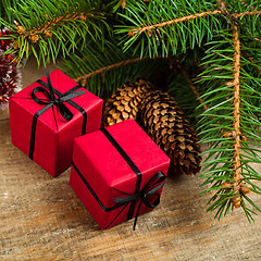 Image showing christmas fir tree with pinecones and decorative boxes