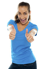 Image showing Overjoyed woman showing double thumbs up