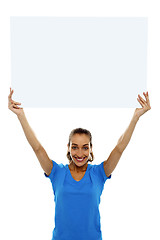 Image showing Woman holding up blank white ad board