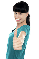 Image showing Attractive woman showing thumbs up gesture