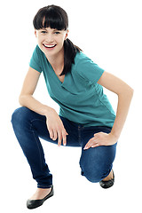 Image showing Good looking female model in squatting posture