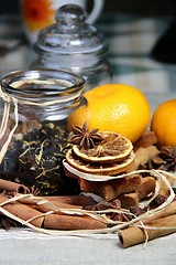 Image showing Cinnamon sticks and dry orange