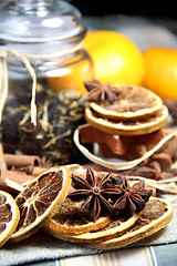 Image showing Cinnamon sticks and dry orange