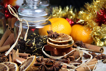 Image showing Cinnamon sticks and dry orange