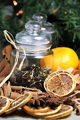 Image showing Cinnamon sticks and dry orange